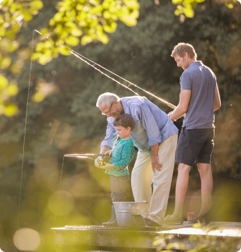 Grandfather, Father, and Son fishing on a sunny afternoon