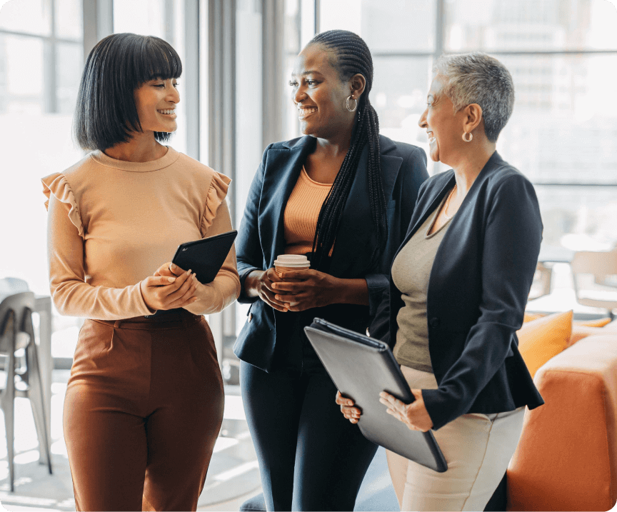 A trio of smiling businesswomen